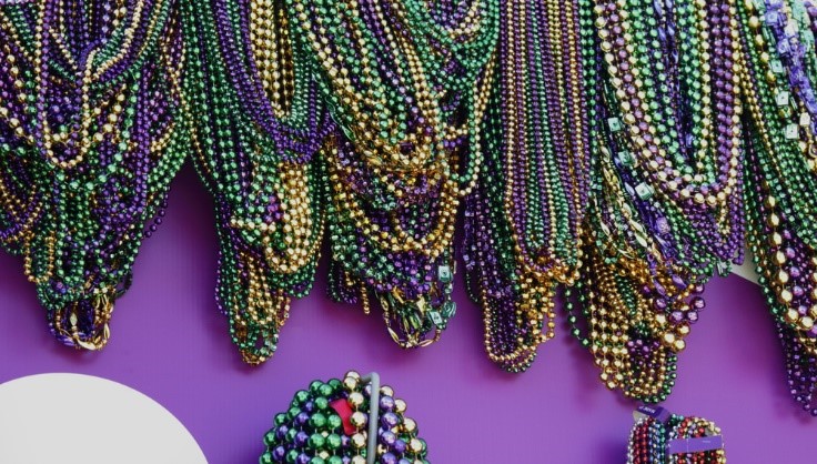 multi-colored necklaces with purple wall