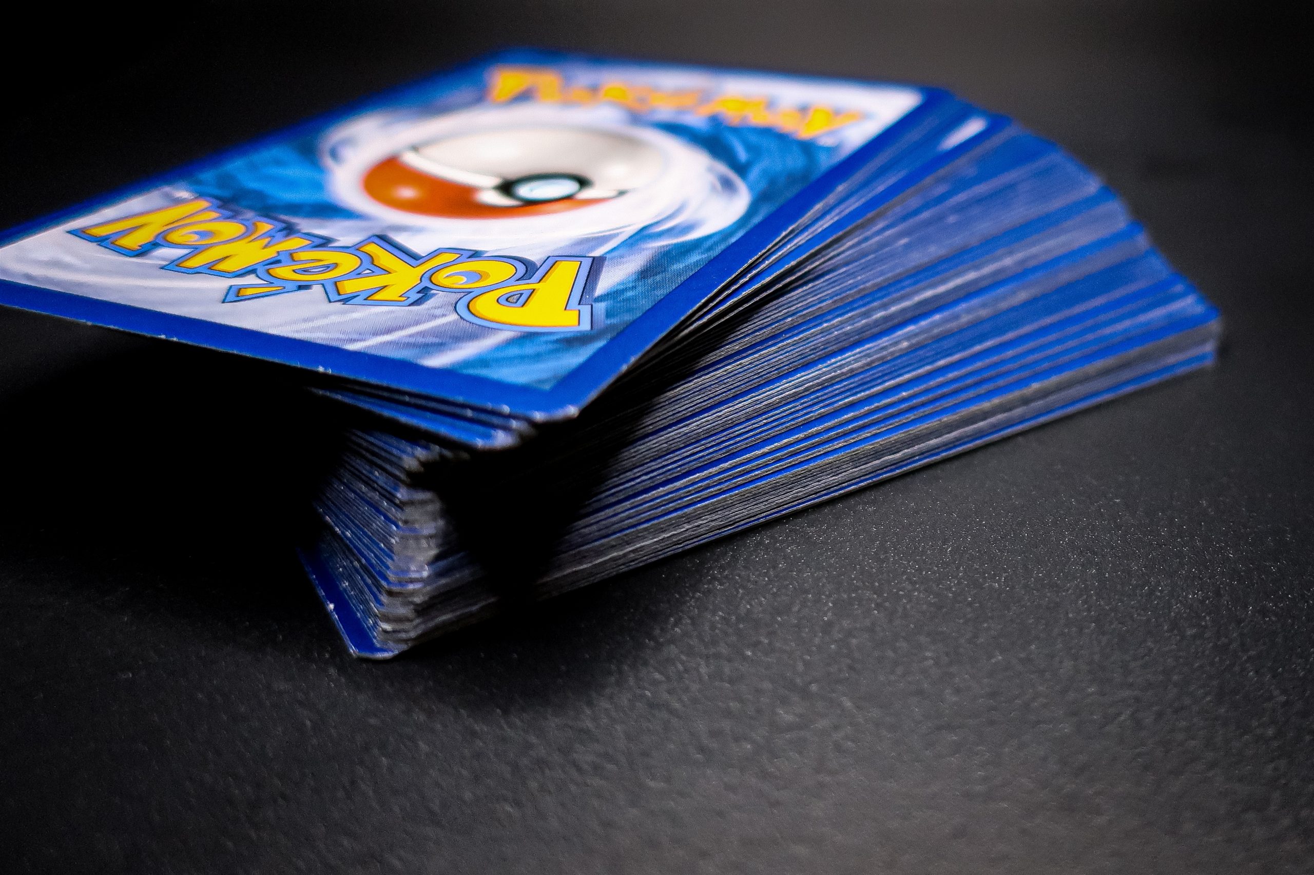 A stack of Pokémon trading cards.