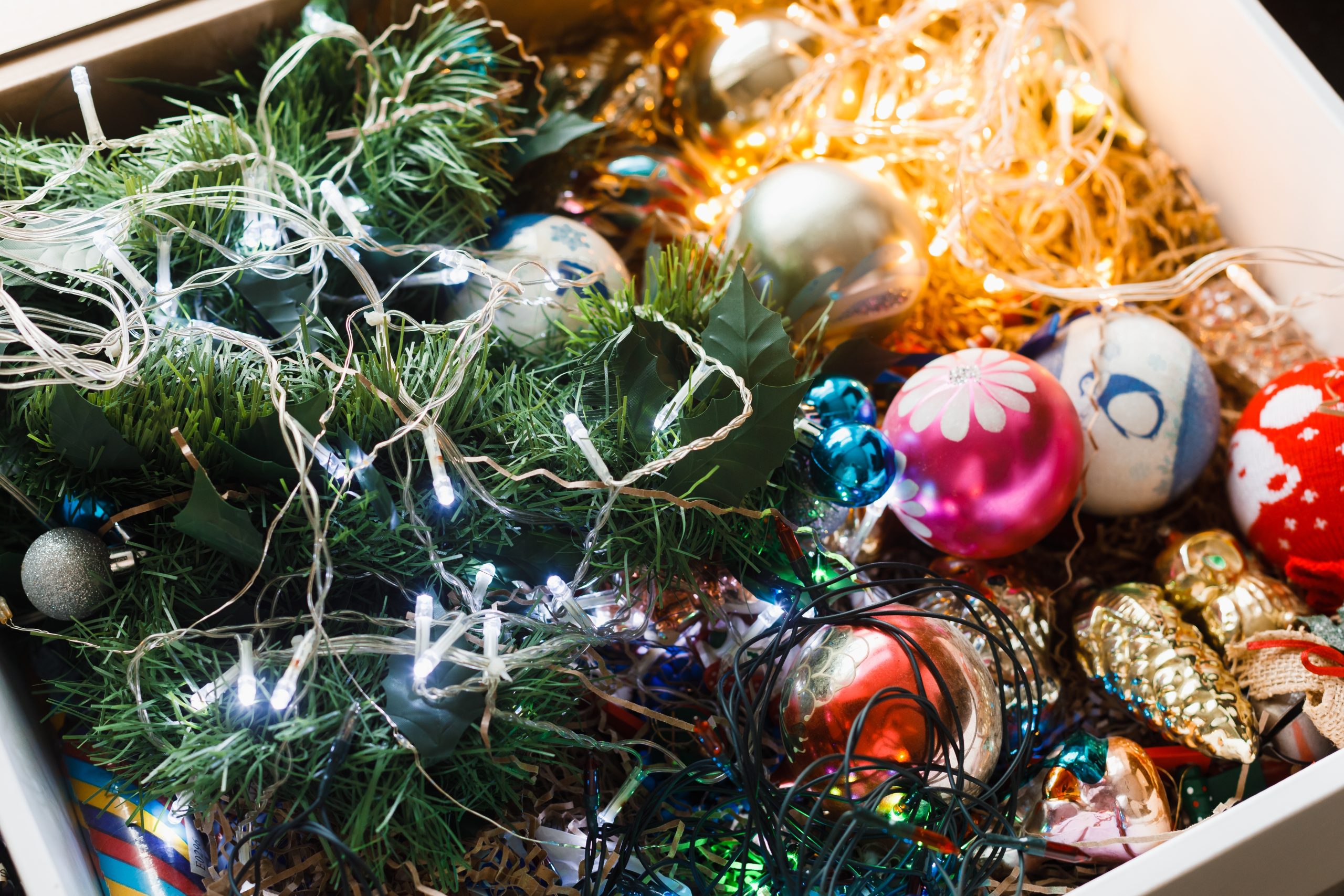 Christmas and holiday decorations in an open box.